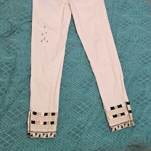 White jeans with decorated hems